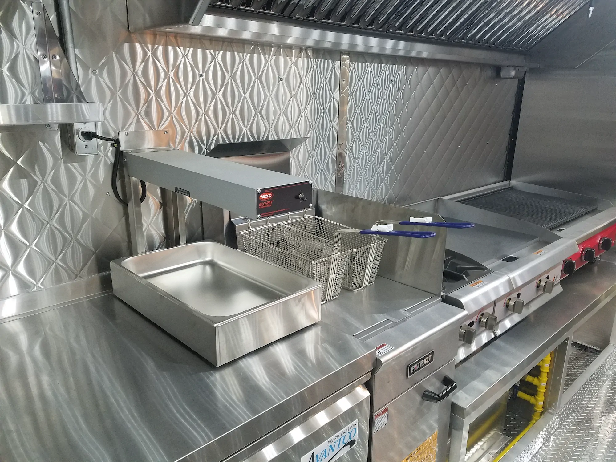 Falcon Pride truck, inside, fryer