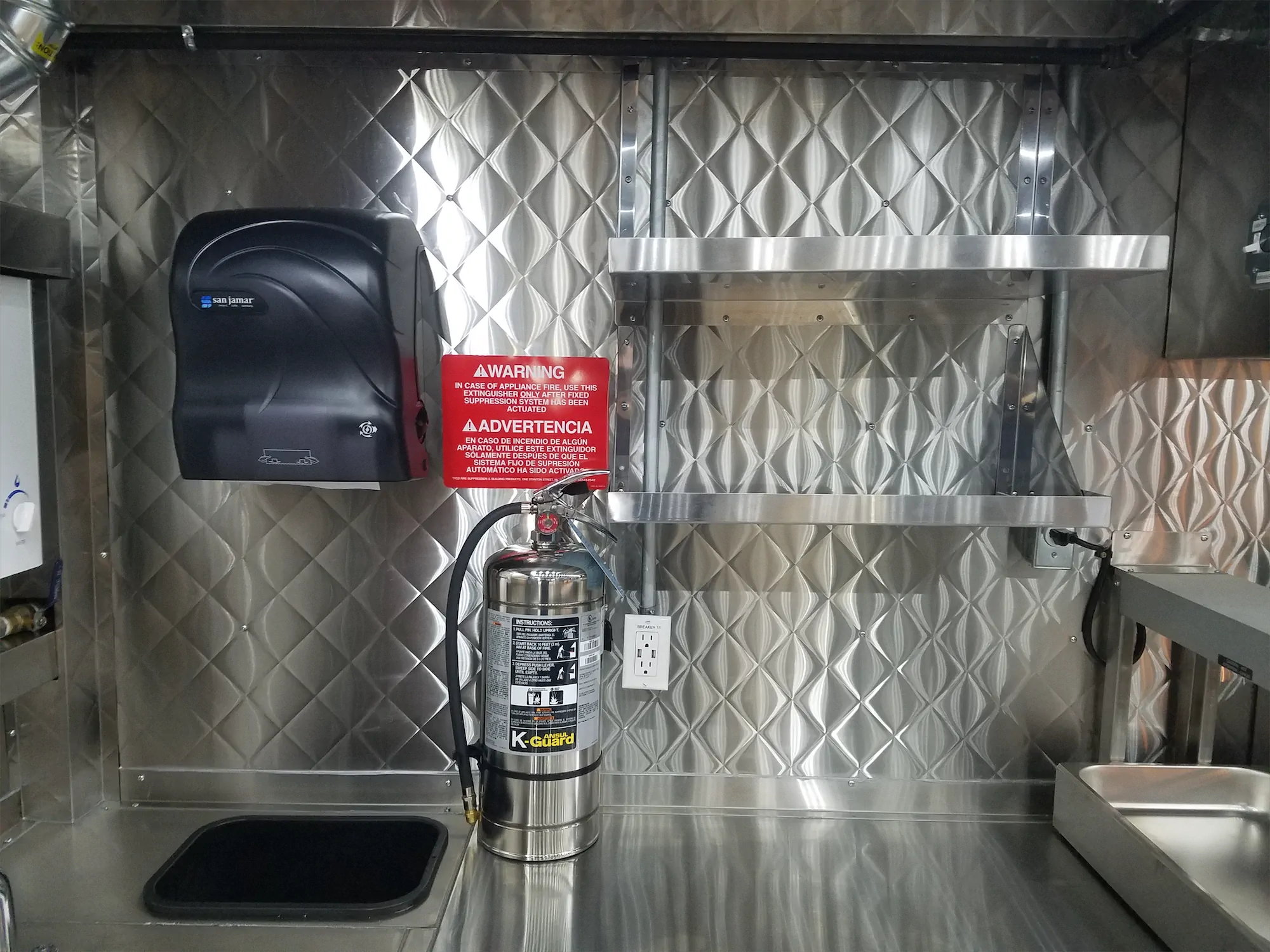 Falcon Pride truck, inside, extinguisher and shelves