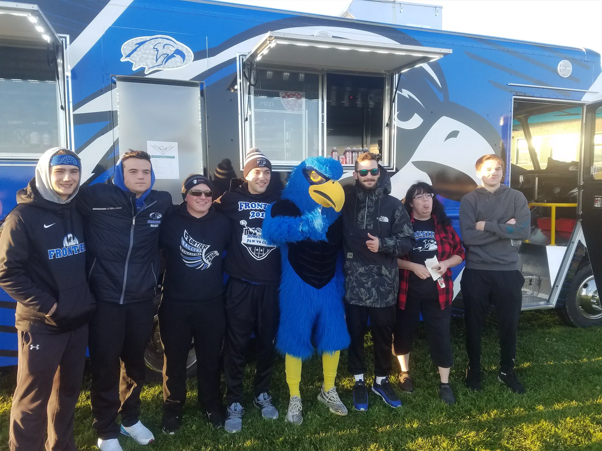 Falcon Pride truck, outside, people standing outside the truck