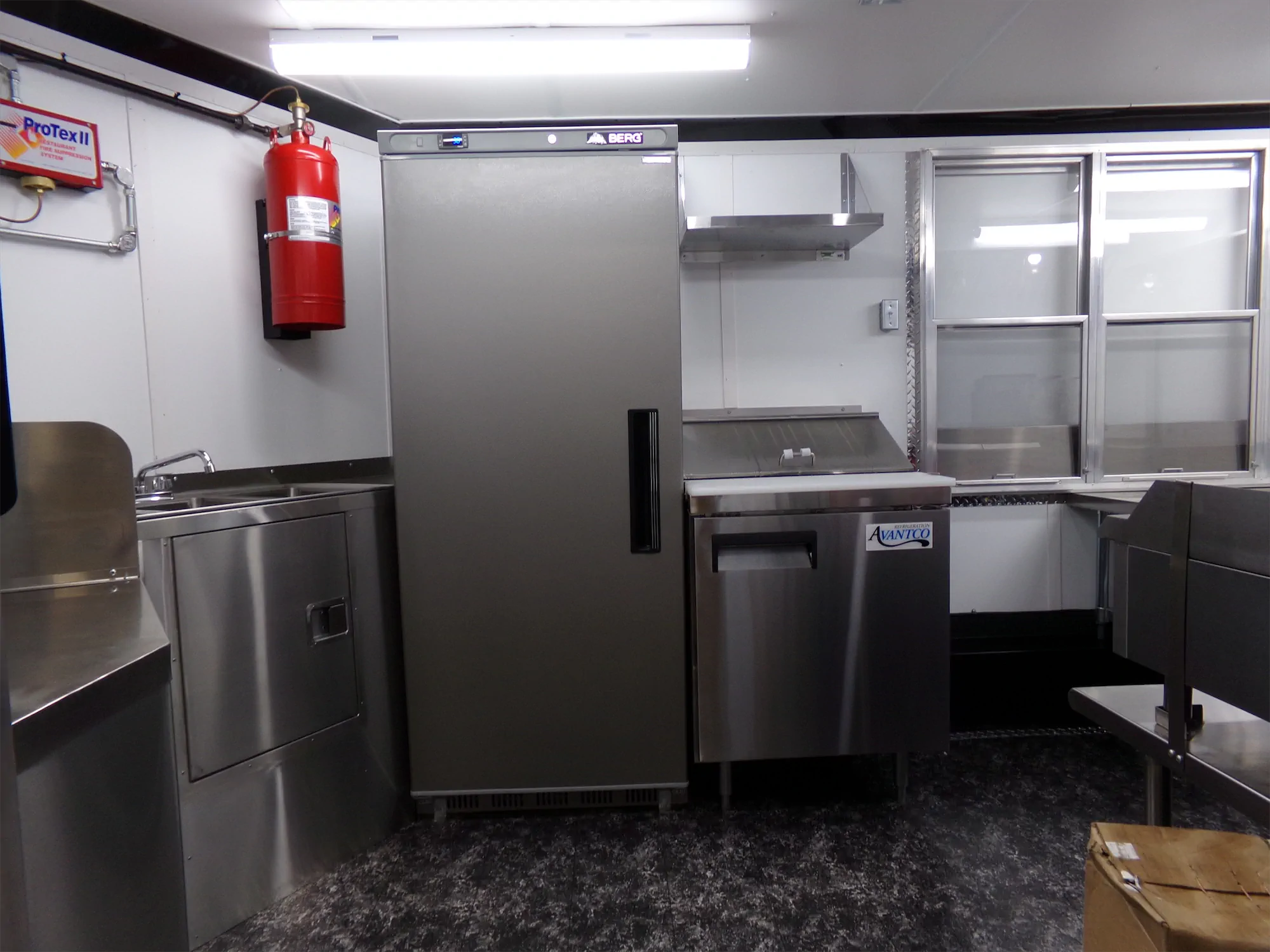 Buffalo Bros Burgers trailer, inside looking at the fridge