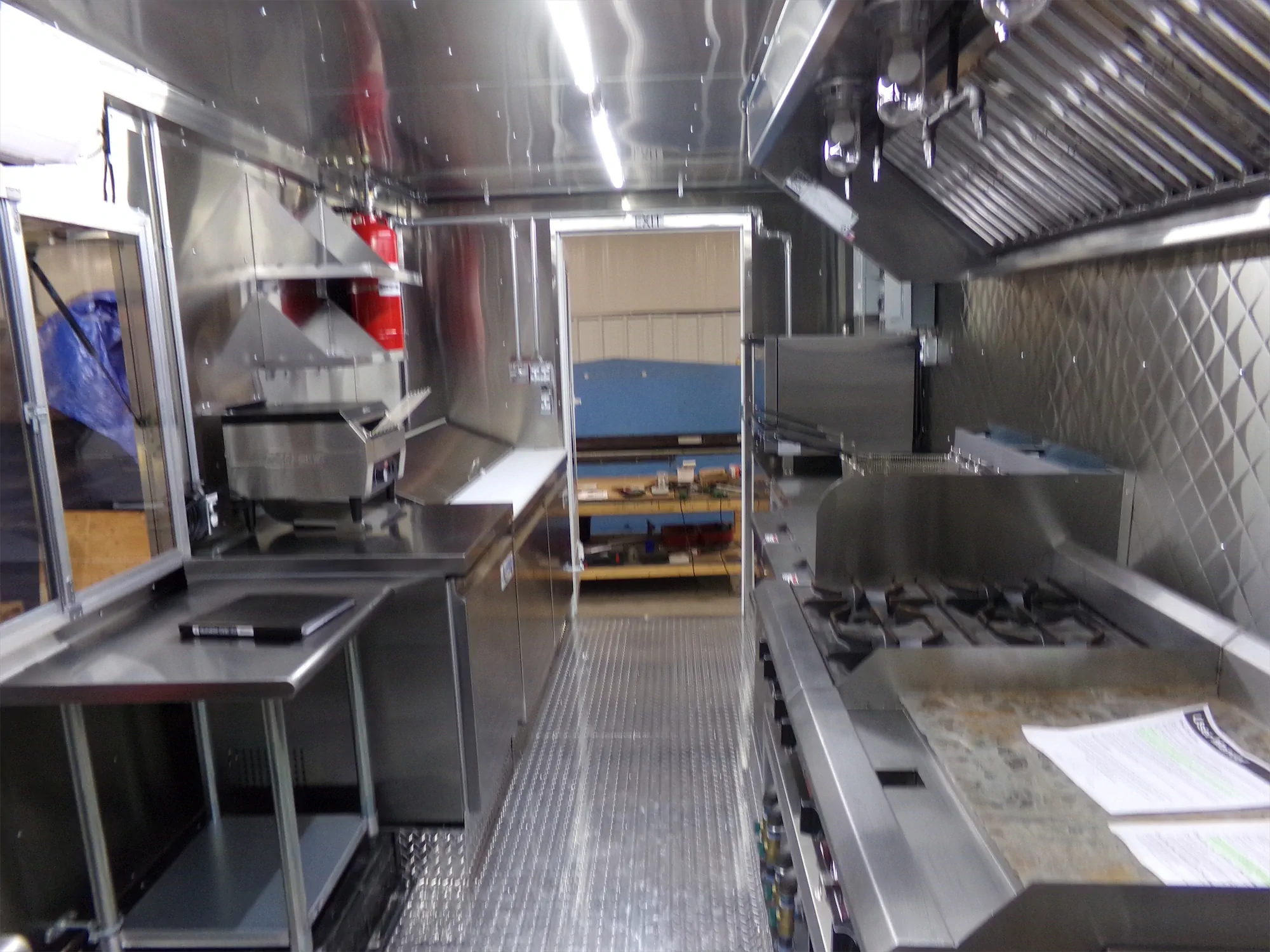 Edgy Vegy Buffalo truck, inside, looking down the length of the truck to the back door