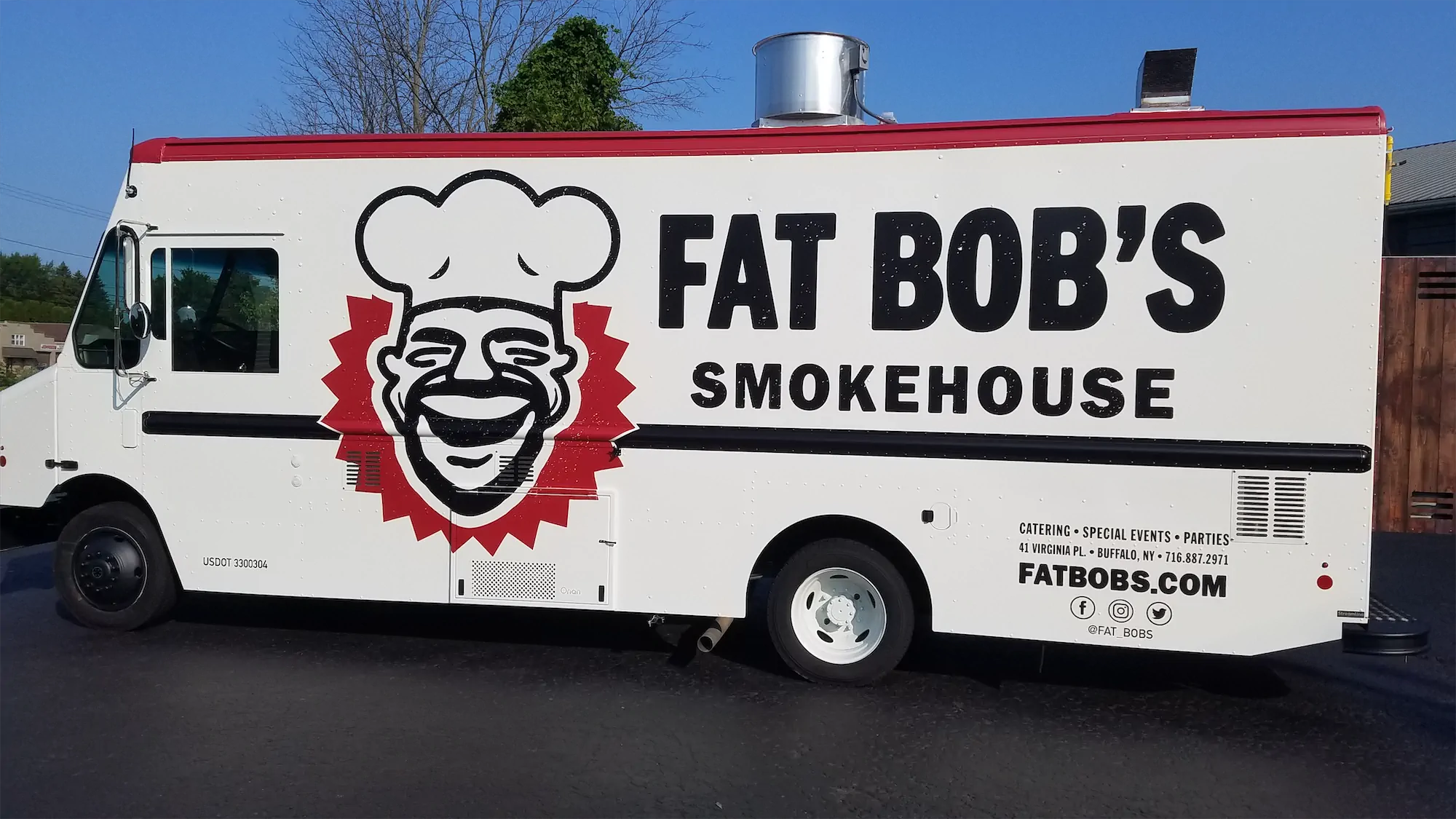 Big Brisket Daddy truck, outside, left side with Fat Bob's Smokehouse logo