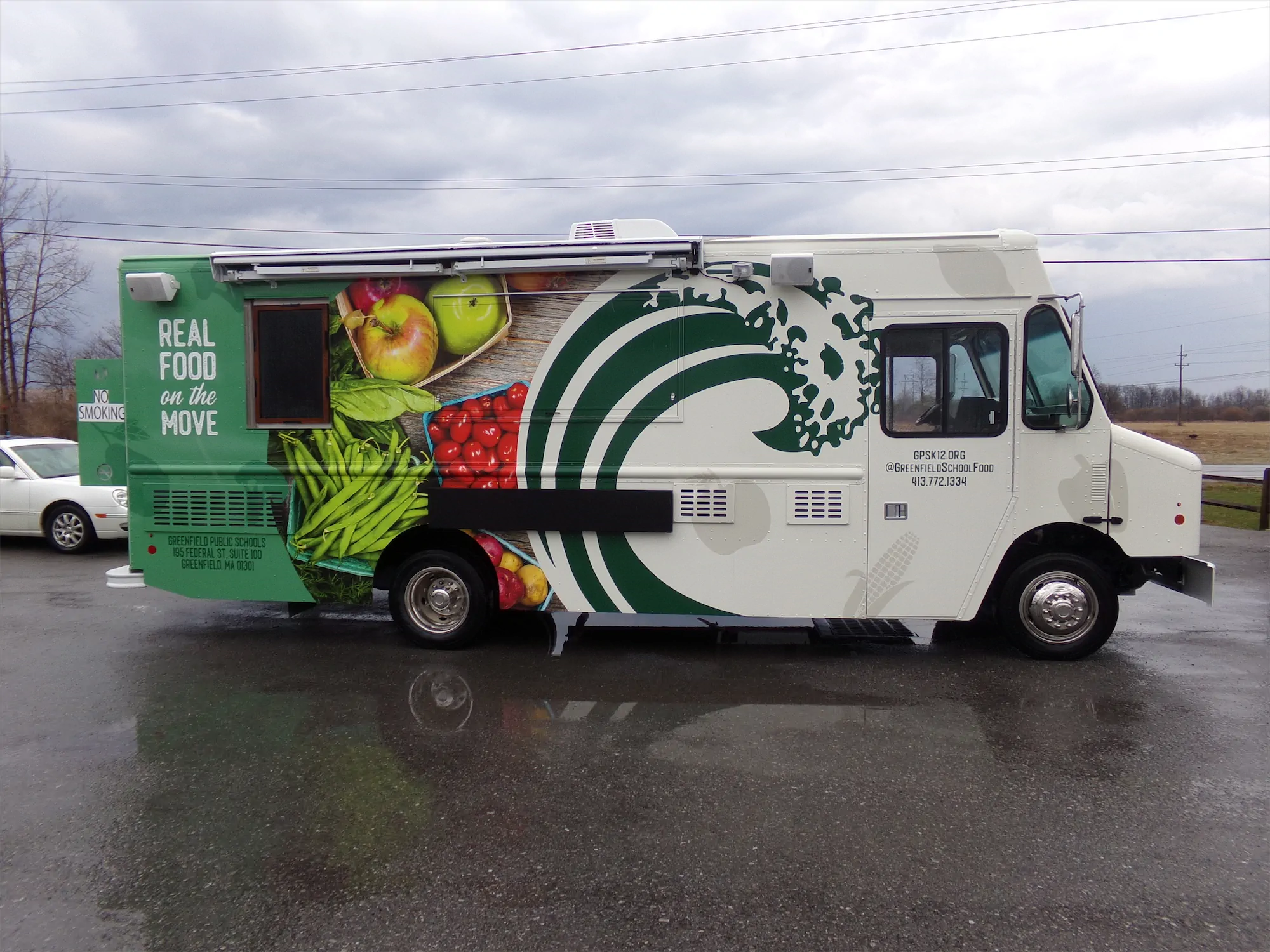Real Food On The Move truck, outside, right side looking at the wrap design