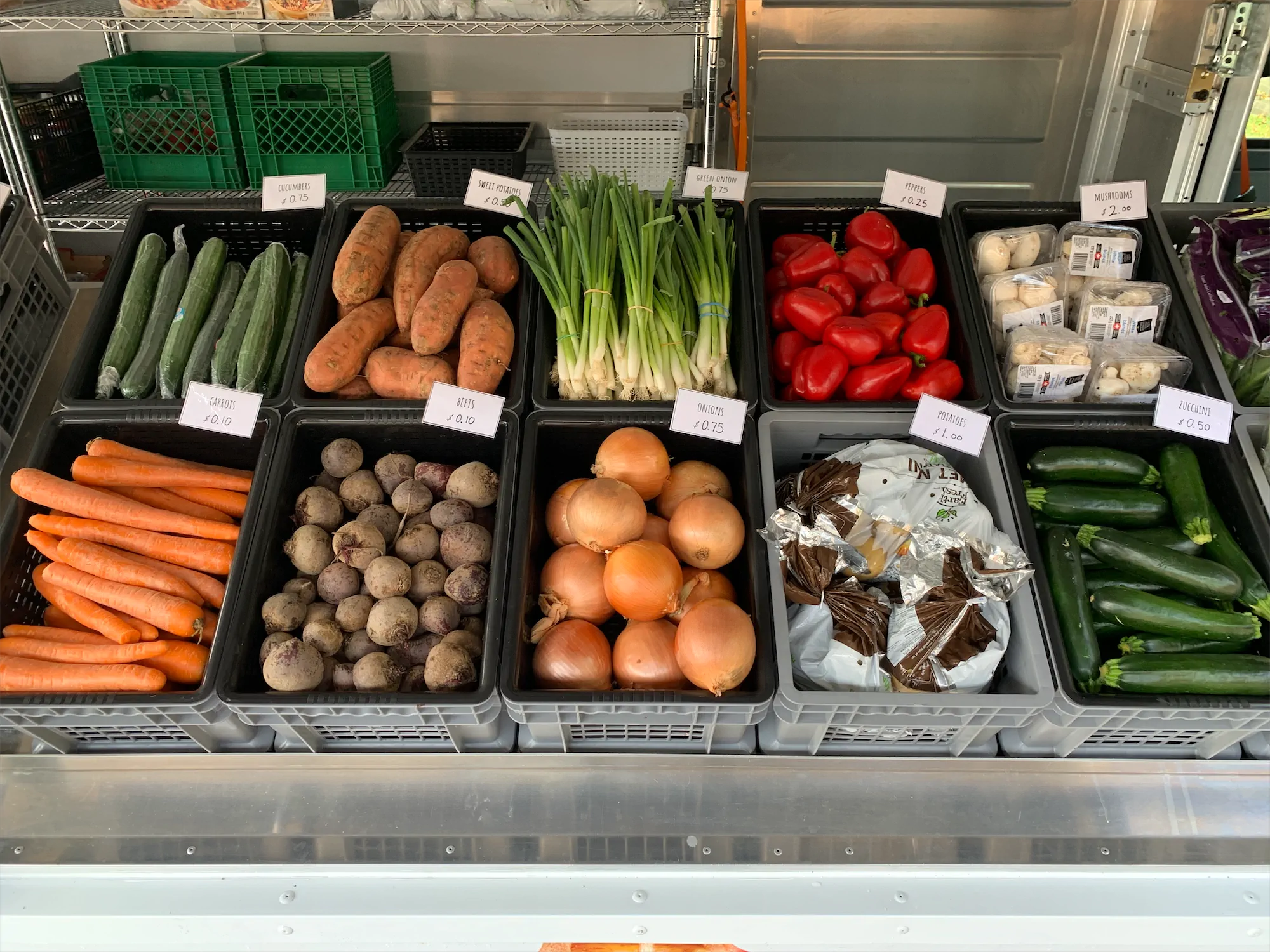 Grow of the Go truck, outside, right side with windows open looking at the produce up close